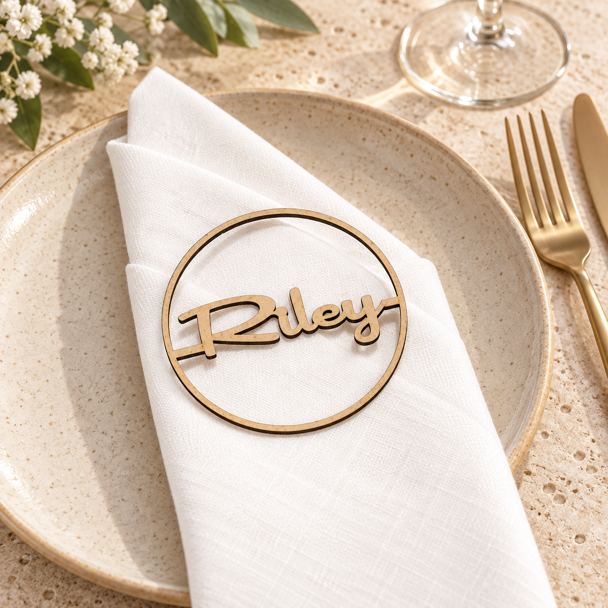 Round laser cut MDF wedding place name Riley on a neutral wedding setting
