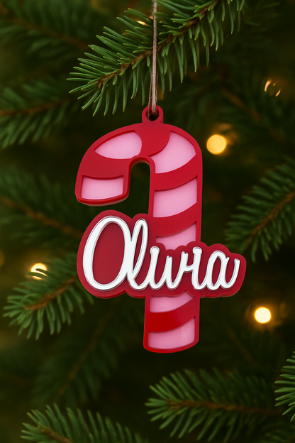 Pink and red Olivia candy cane ornament on a Christmas tree