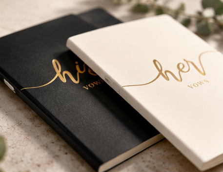 His & Her wedding vow books arranged together at an angle