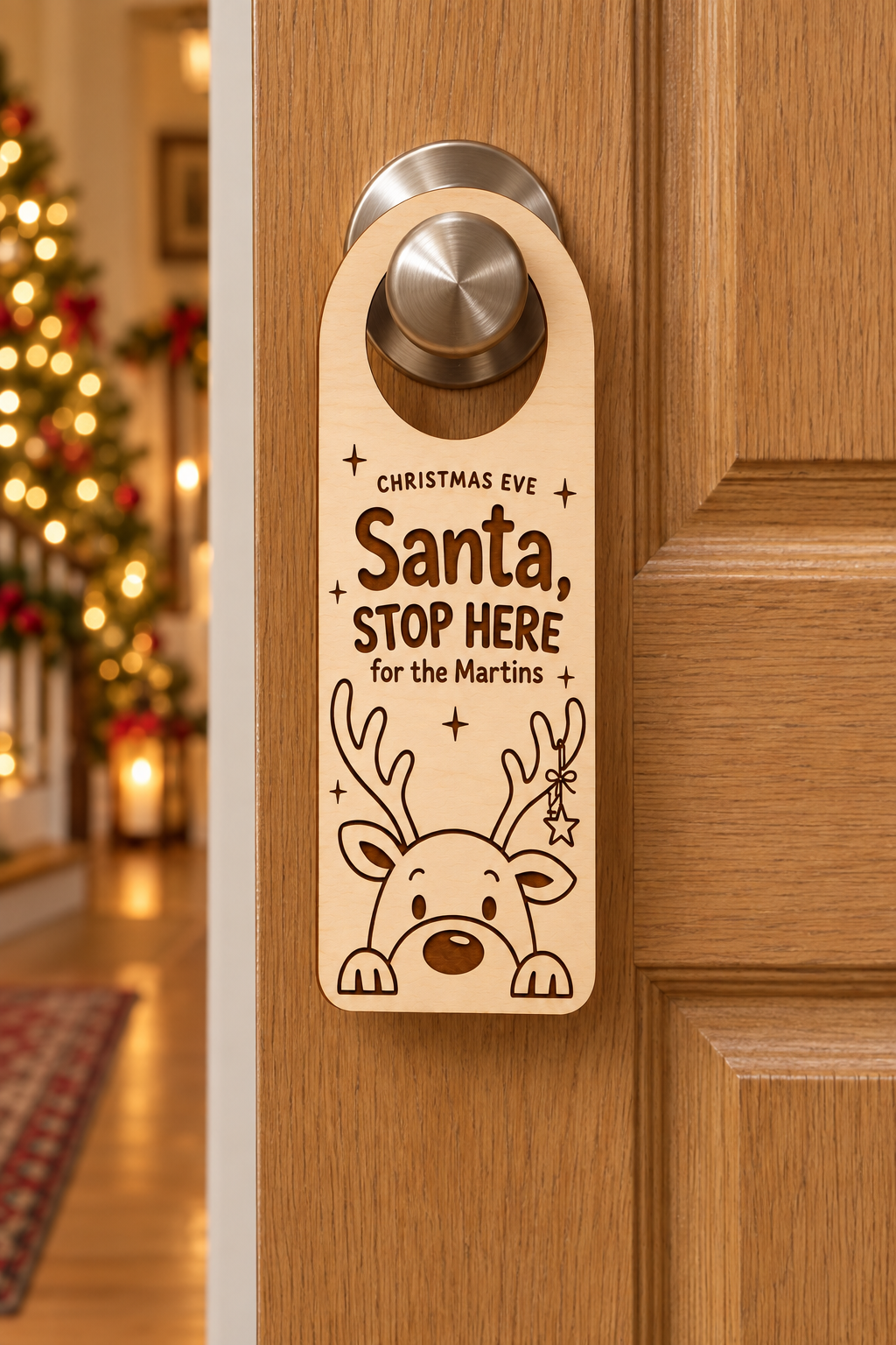 Personalised wooden Santa Stop Here Christmas door hanger for the Martins, with engraved reindeer and closed hanging hoop